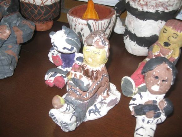 photo of clay storyteller dolls made by schoolchildren